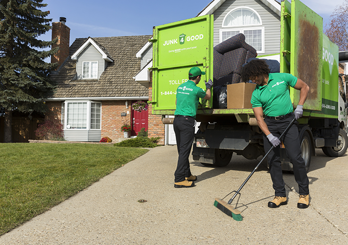 Junk crew cleaning up after completing a removal job