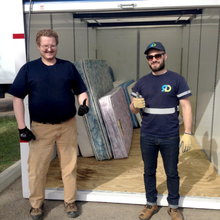 Evergreen Recycling's mattress recycling team in Edmonton collect mattress items from the U of A Eco Move Out.