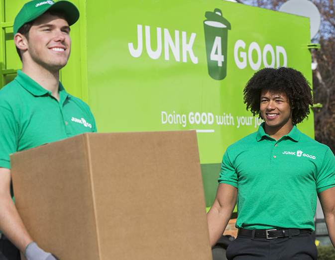 Junk removal staff carry out rubbish and items for donation