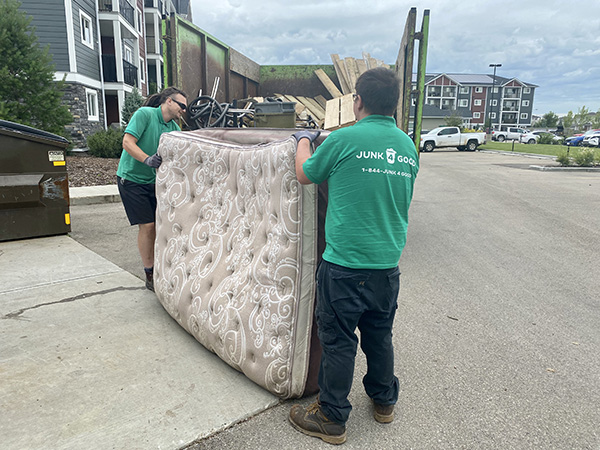 Curbside pickup of old mattress.