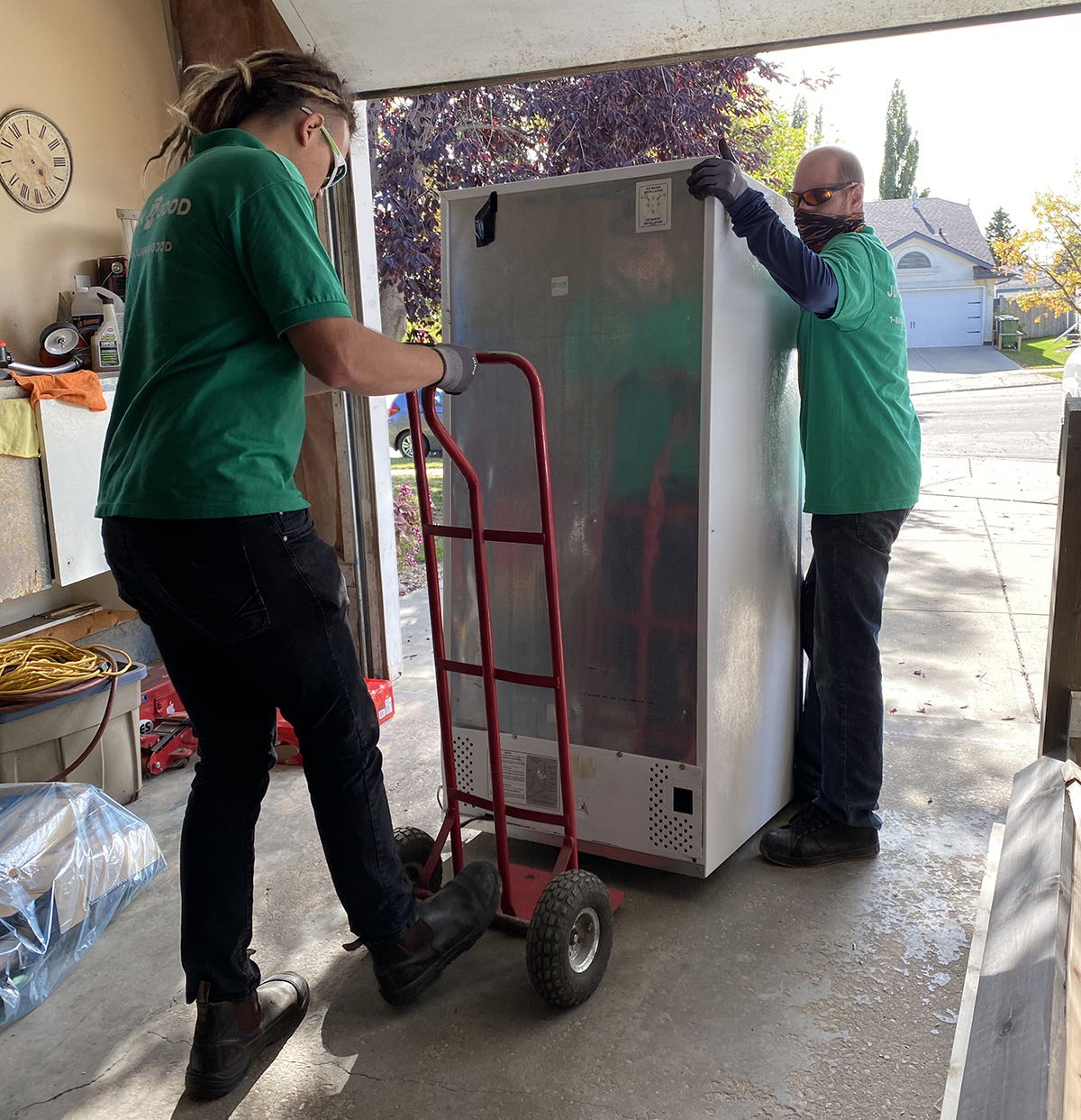 Junk 4 Good Staff carefully removing old refrigerator