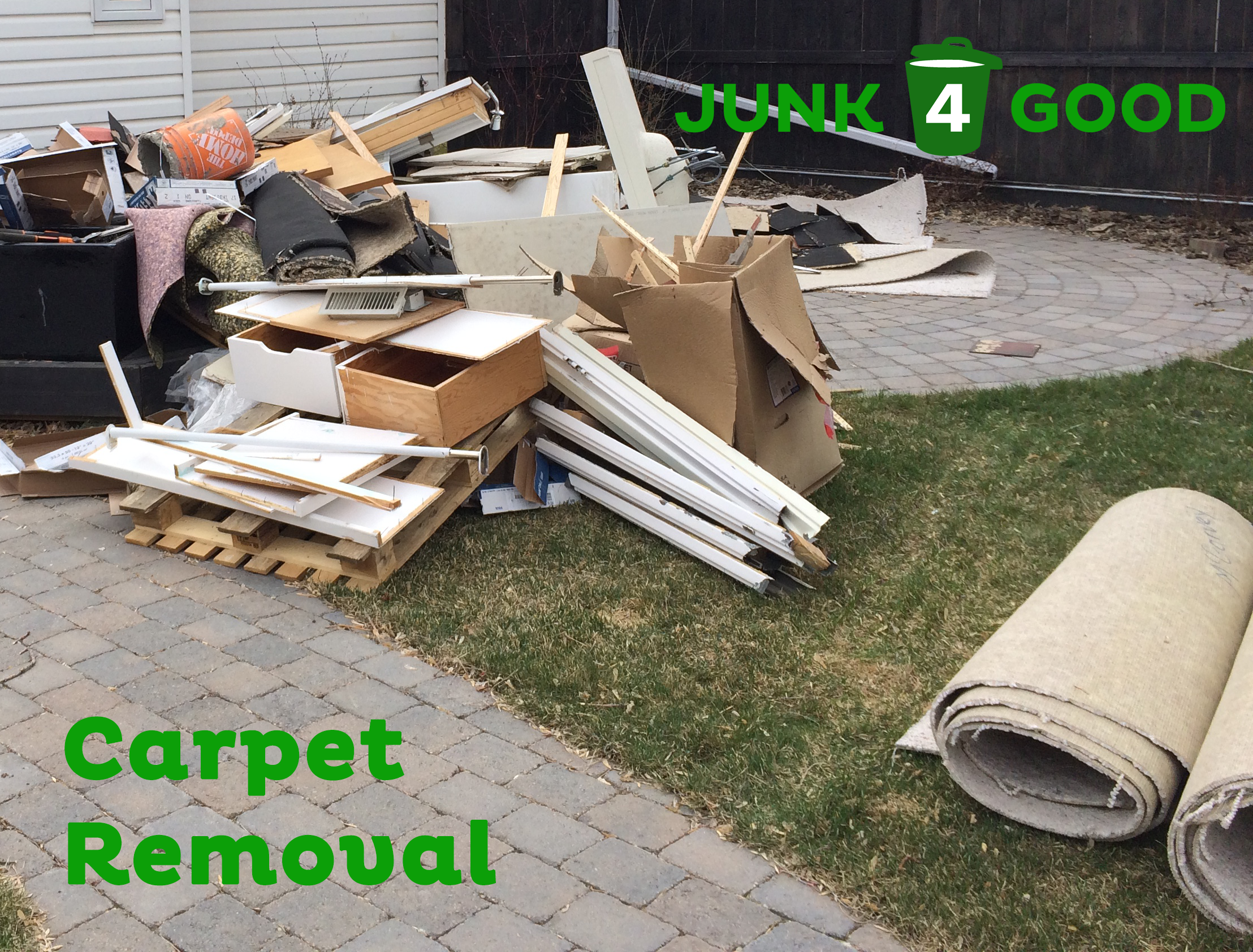 A pile of old carpet that has been removed from a house.